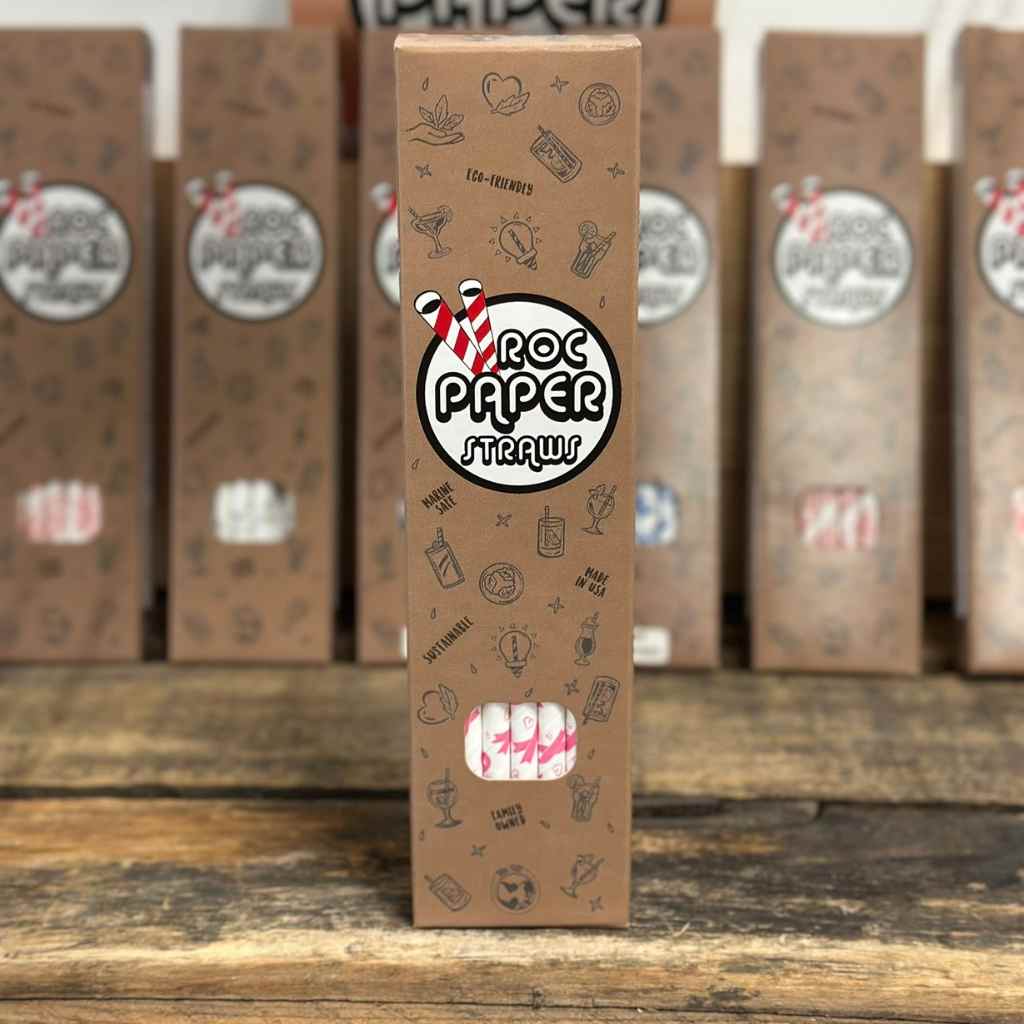 22-pack of paper straws with Roc Paper Straw branding on cover on wood background.
