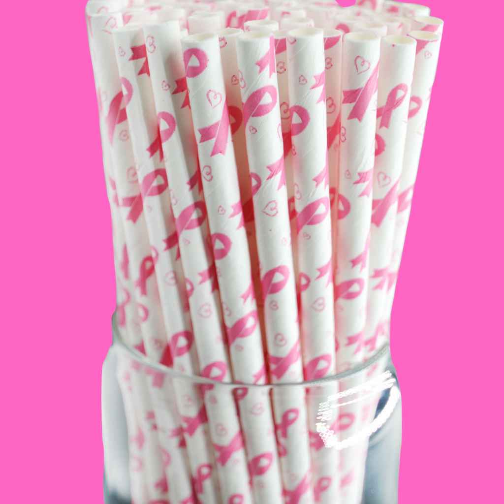Pink ribbon straws on pink background.