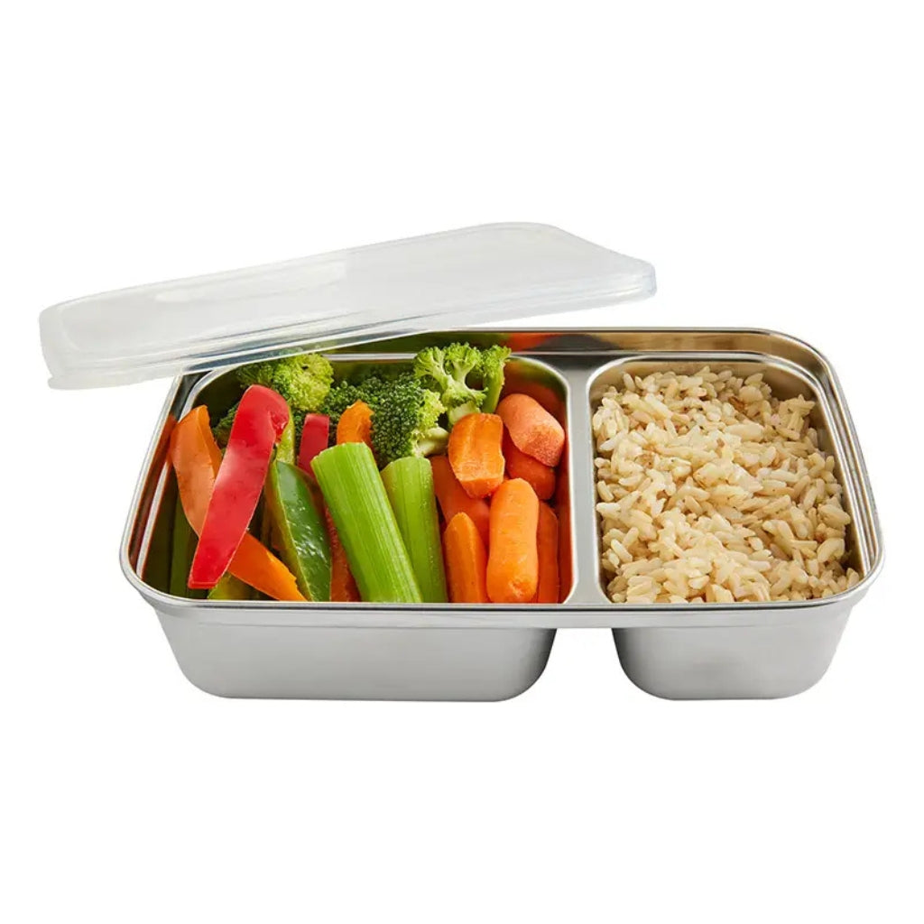 Stainless steel lunch box with compartments filled with vegetables and rice on a white background