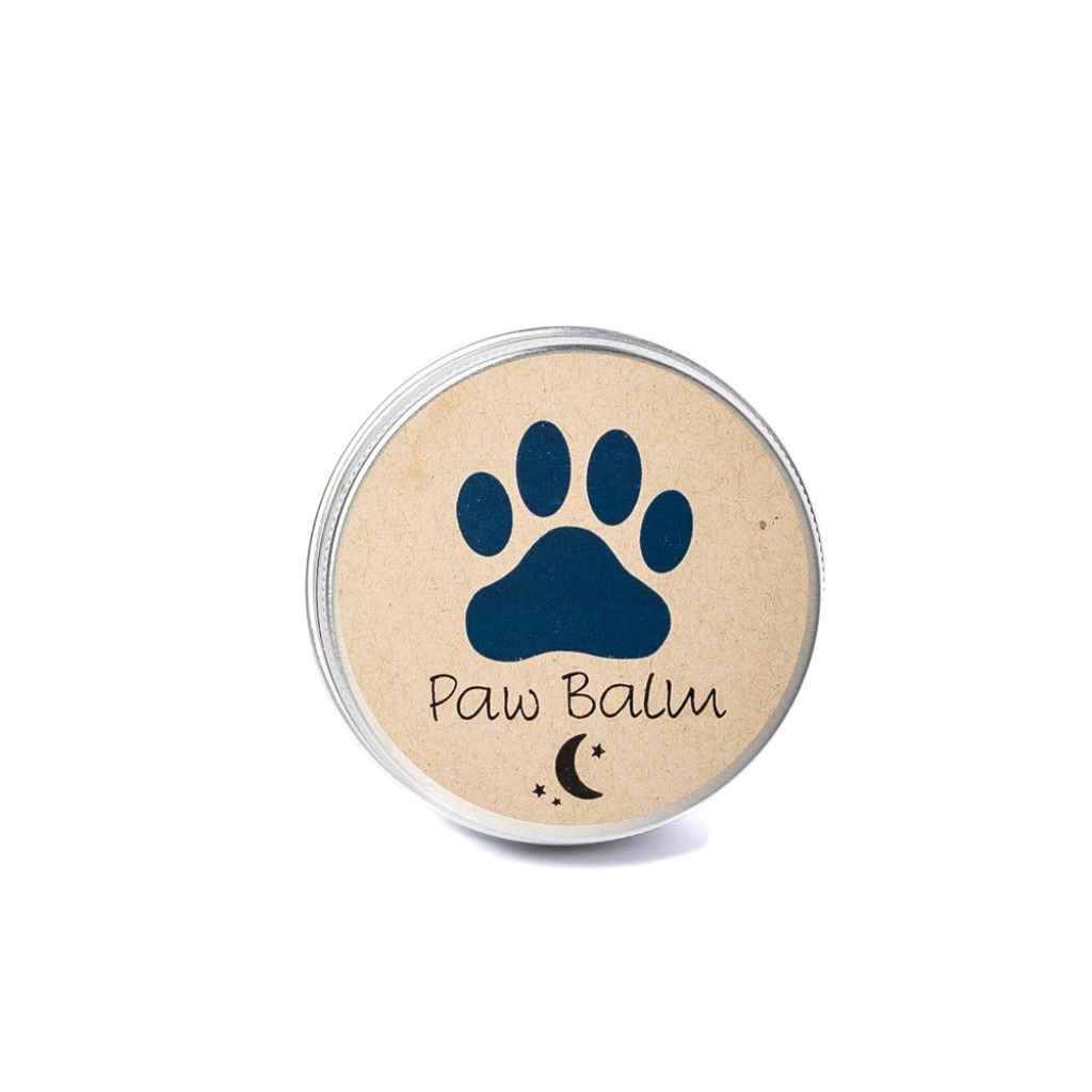 Mona Moon all-natural paw balm to heal irritated and rough dog paw pads. Made in Rochester NY USA. 2oz tin container with dog paw print