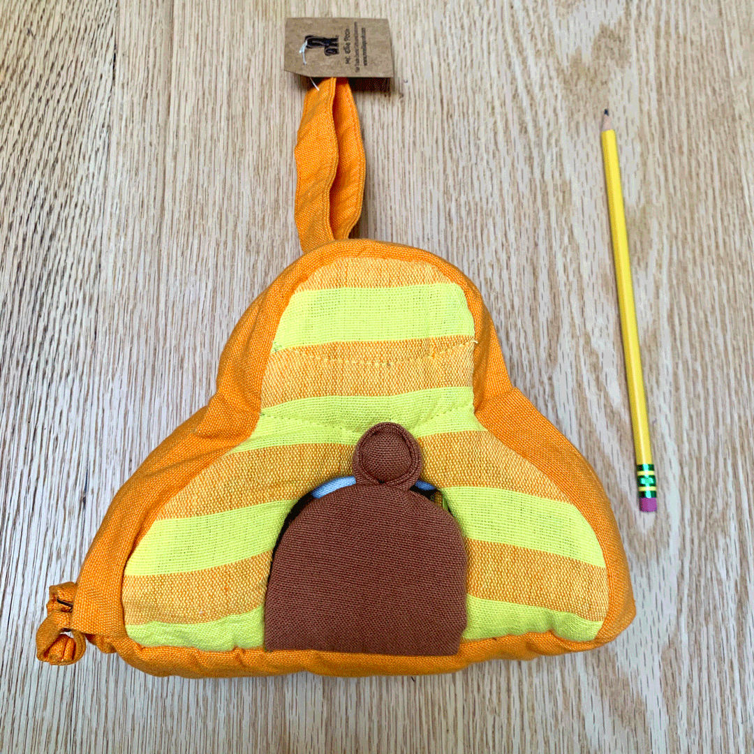 GIF of closed beehive, then door opened with one stuffed bee visible, then hive unzipped and 4 bees visible, then bees outside of the hive smelling the flower on the hive. Hive is measured next to a standard pencil, and measures approximately 1.5 as long as the pencil