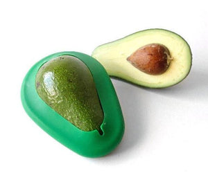 avocado slice, and avocado hugger on ripe avocado