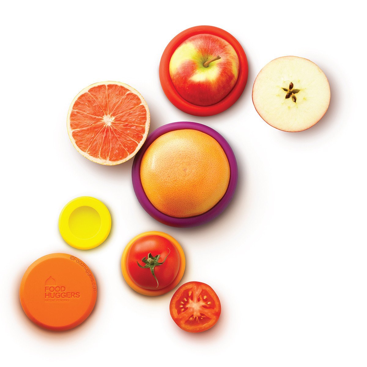 grapefruit, red apple, tomato, all halved, one half using multicolored food hugger