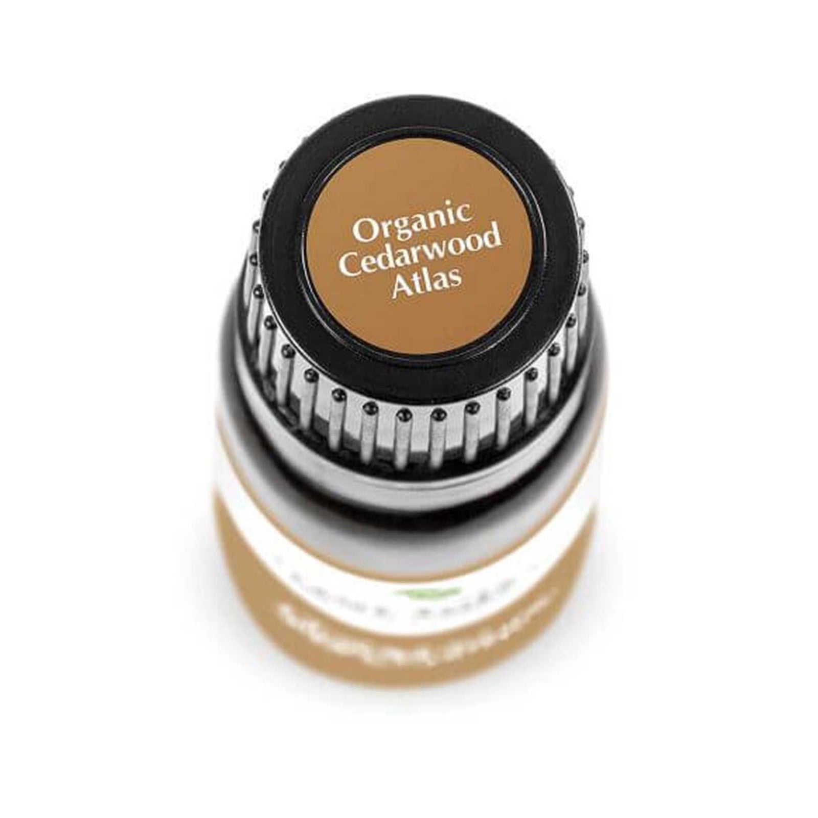 birds eye view of black bottle with brown label. reads "organic cedarwood atlas" 10 ml