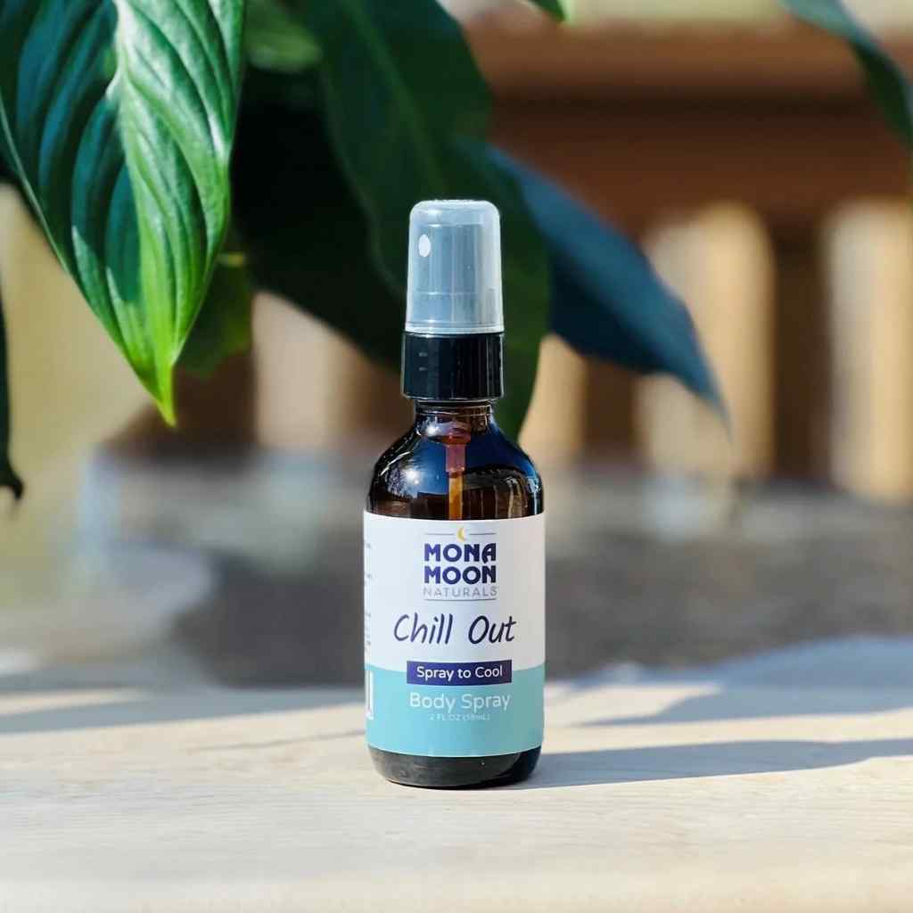 Mona Moon Naturals Chill Out spray bottle on a table with plants in the background