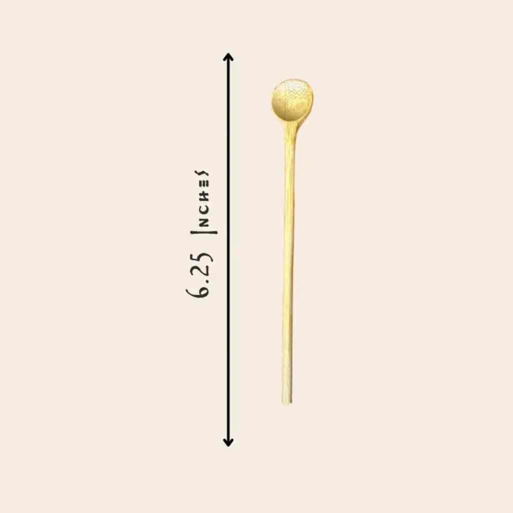 long wooden spoon on beige background with dimensions
