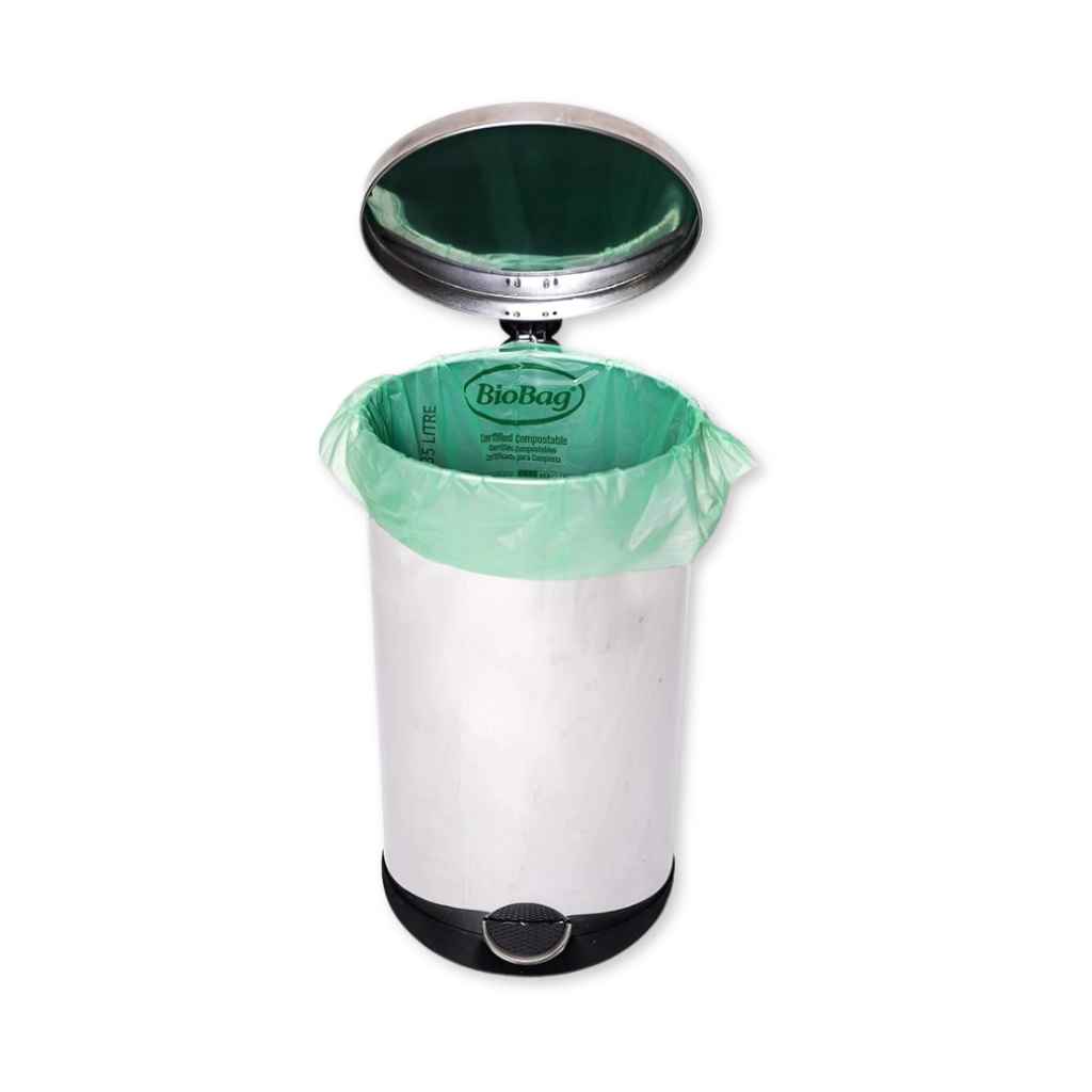 White trash can with green liner and 'BioBag' branding on a white background