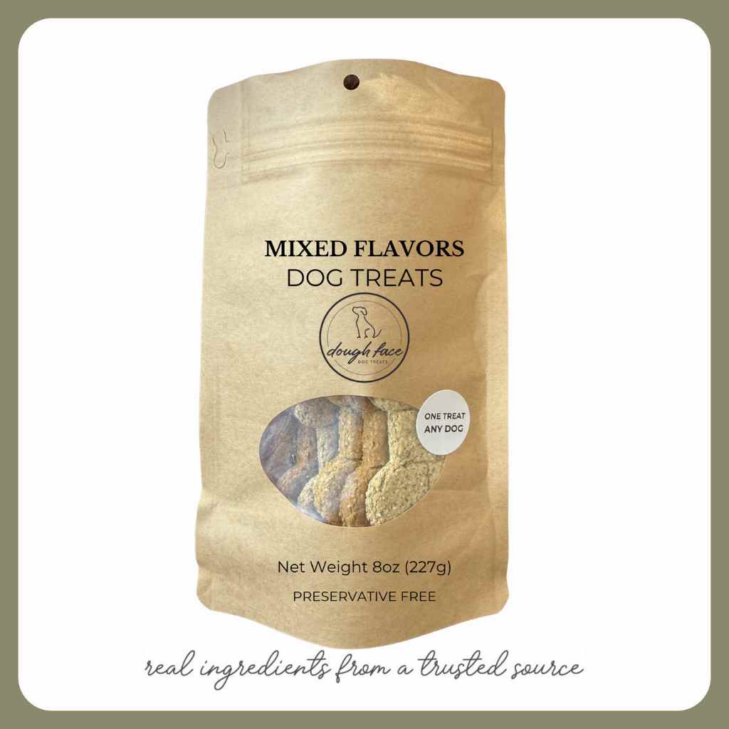 Package of mixed flavors dog treats with visible ingredients on a white background
