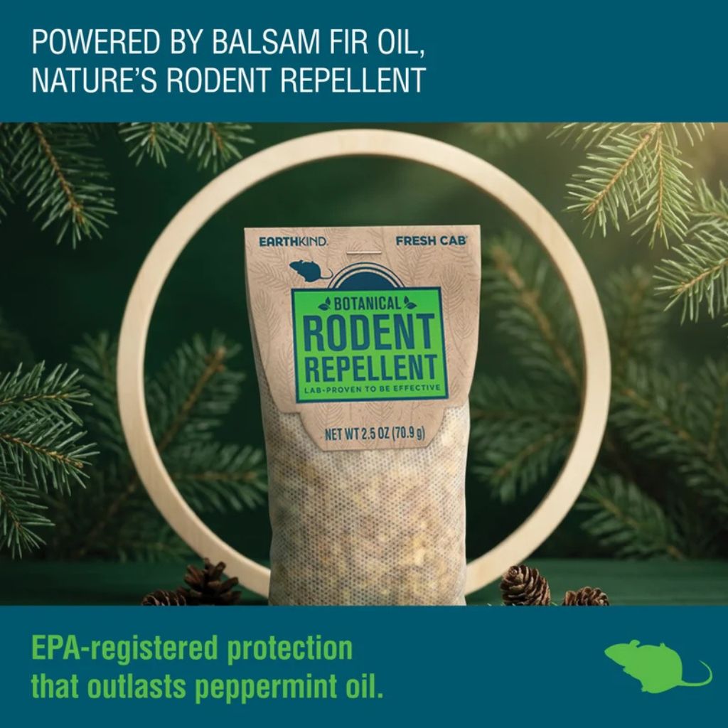 A bag of botanical rodent repellent against a back drop of evergreen to show it's powered by balsam fir oil.