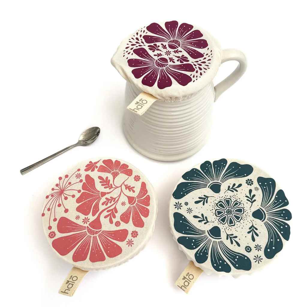 Set of floral covers with a jug on a white background
