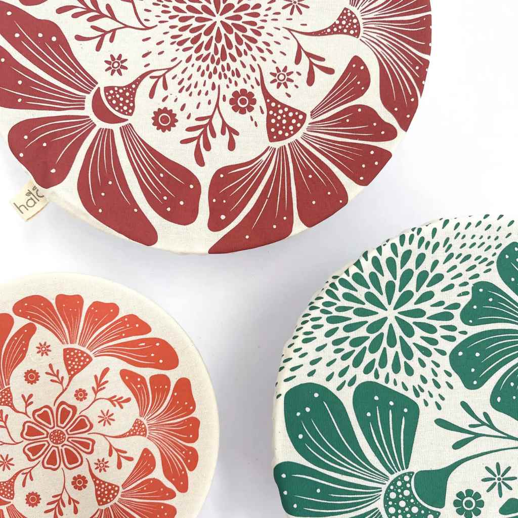 Three decorative bowl coasters with floral patterns on a white background