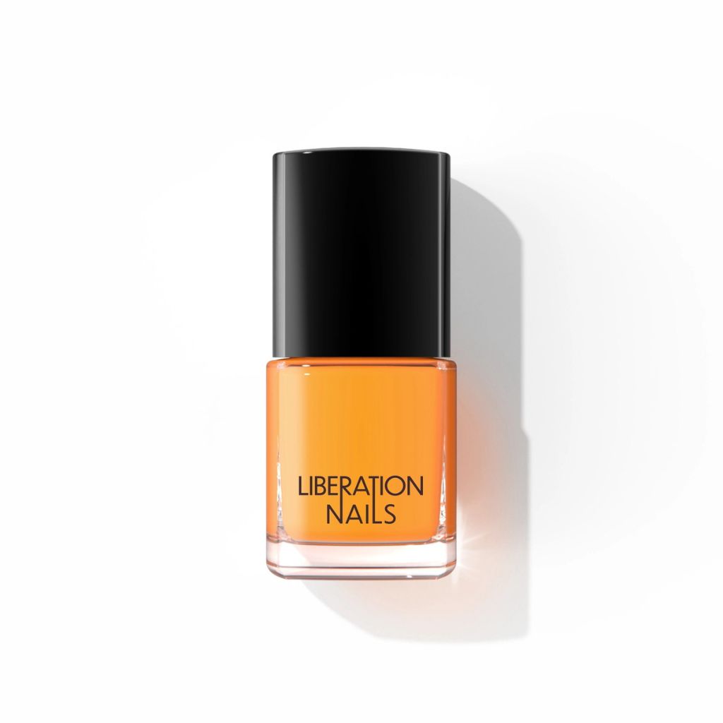 A bottle of orange nail polish  called Goodyear with a black cap, labeled 'LIBERATION NAILS', centered on a white background with a soft shadow.