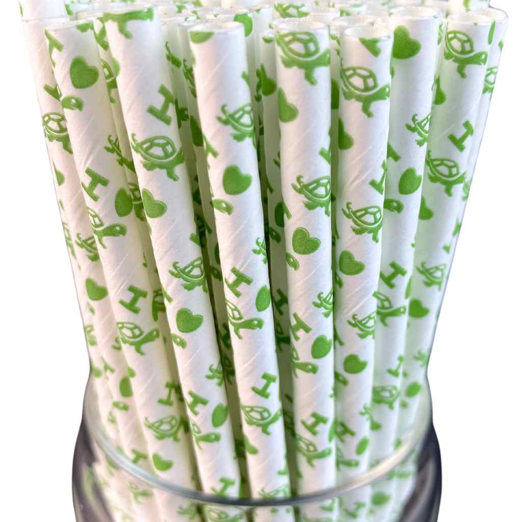 White paper straws with Green turtles with the letter "I" and a green heart in a clear holder.