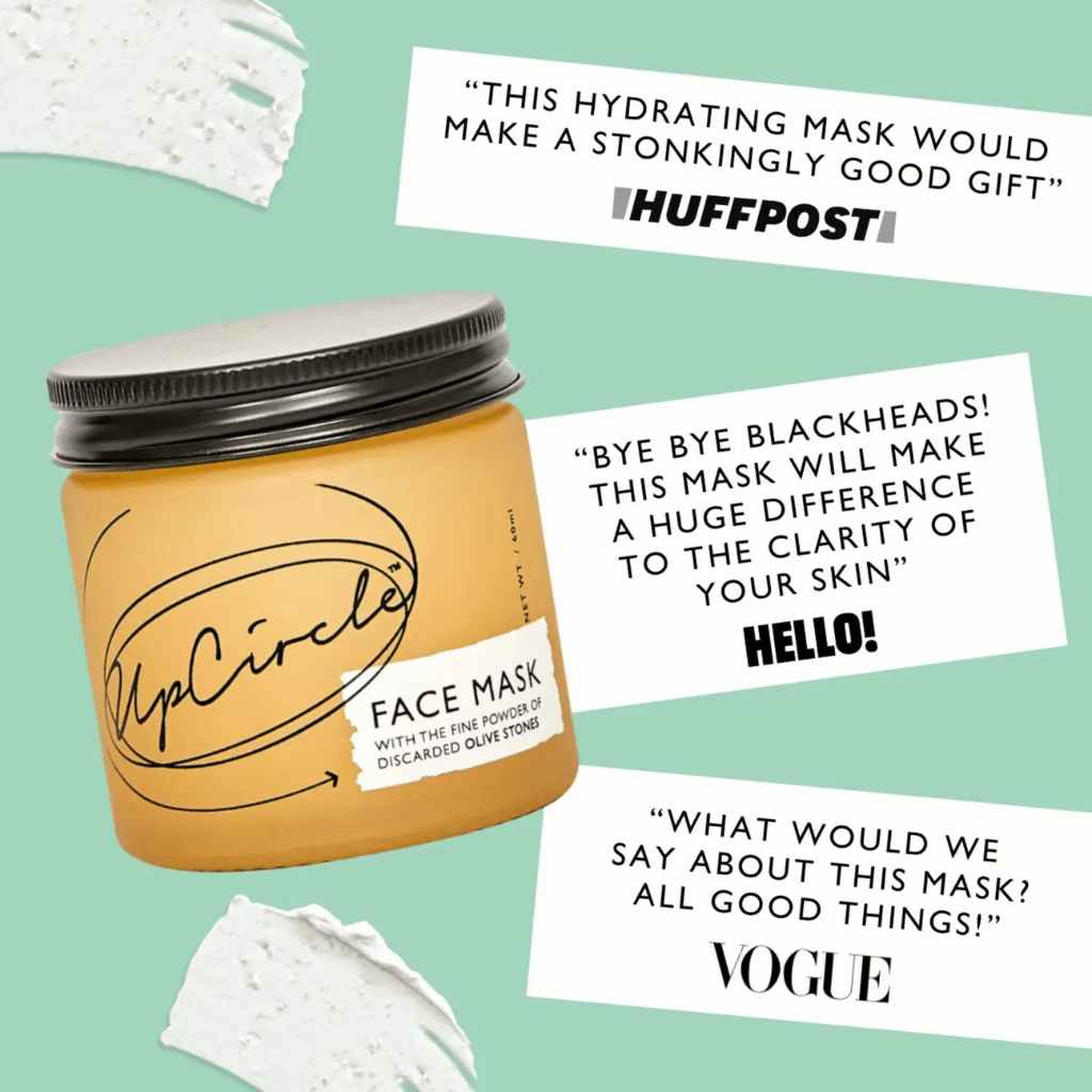 UpCircle face mask jar with positive reviews from HuffPost, Hello!, and Vogue on a green background