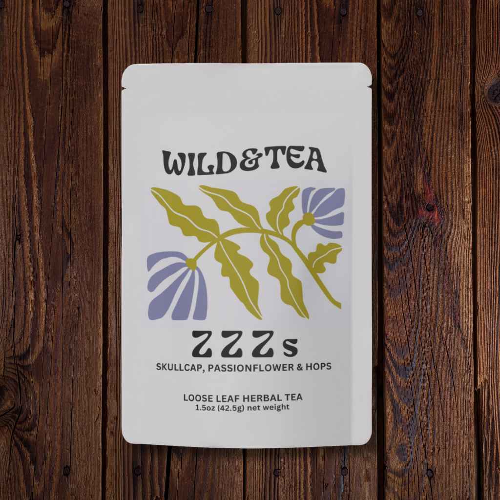 Tea package labeled 'Wild &amp; Tea ZZZs' on a wooden surface