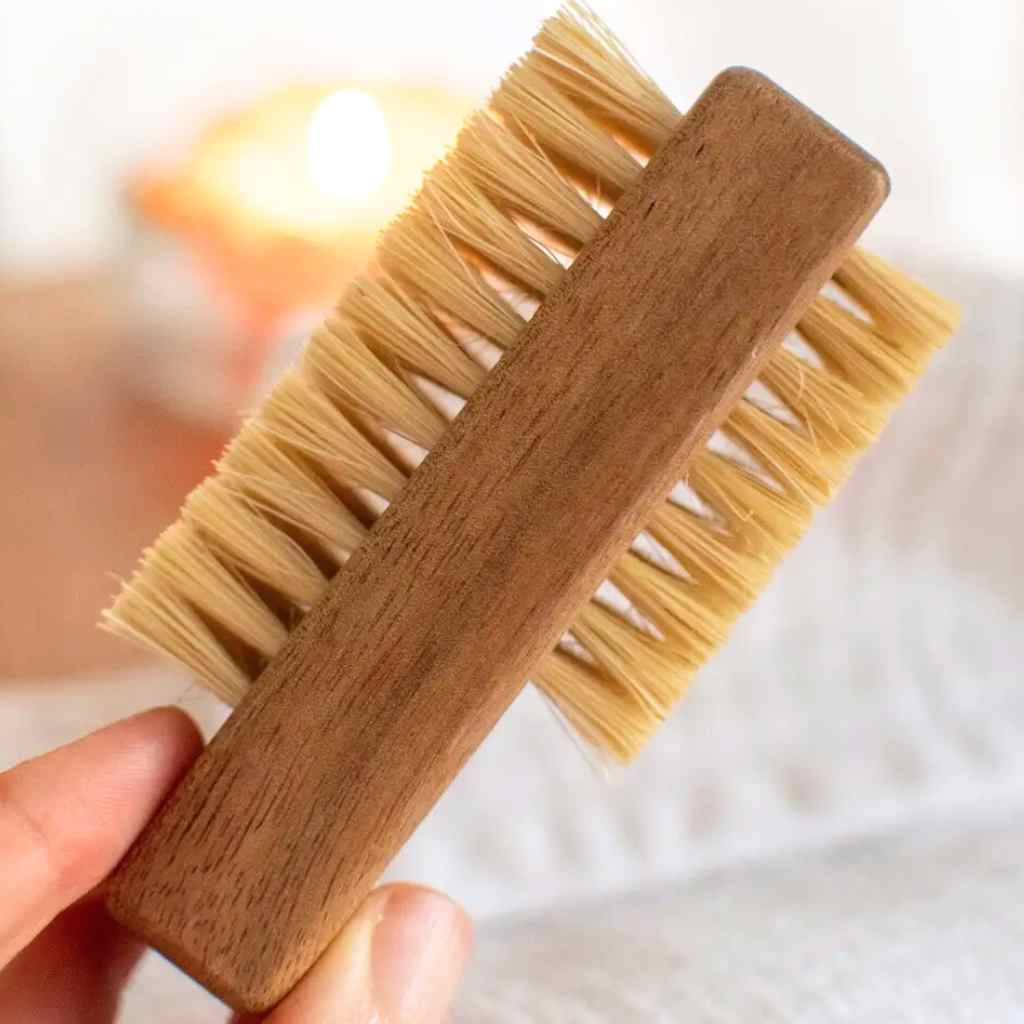 Close up of wood nail brush with white backroung.