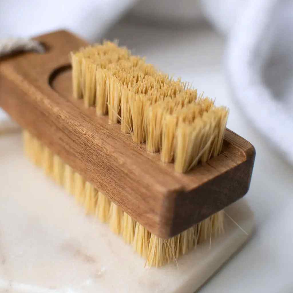 Close up of small row of sisal bristles on white backgroumd.