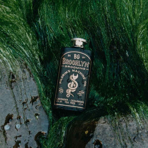 black stainless steel flask containing Brooklyn Grooming Pilgrim's Machine Oil