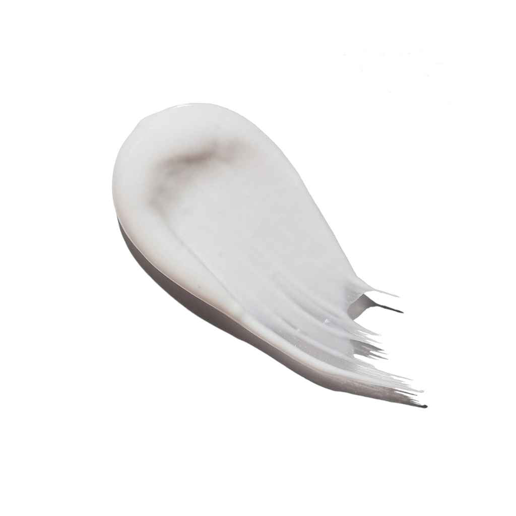 smear of white toothpaste shown to describe color and consistency of product