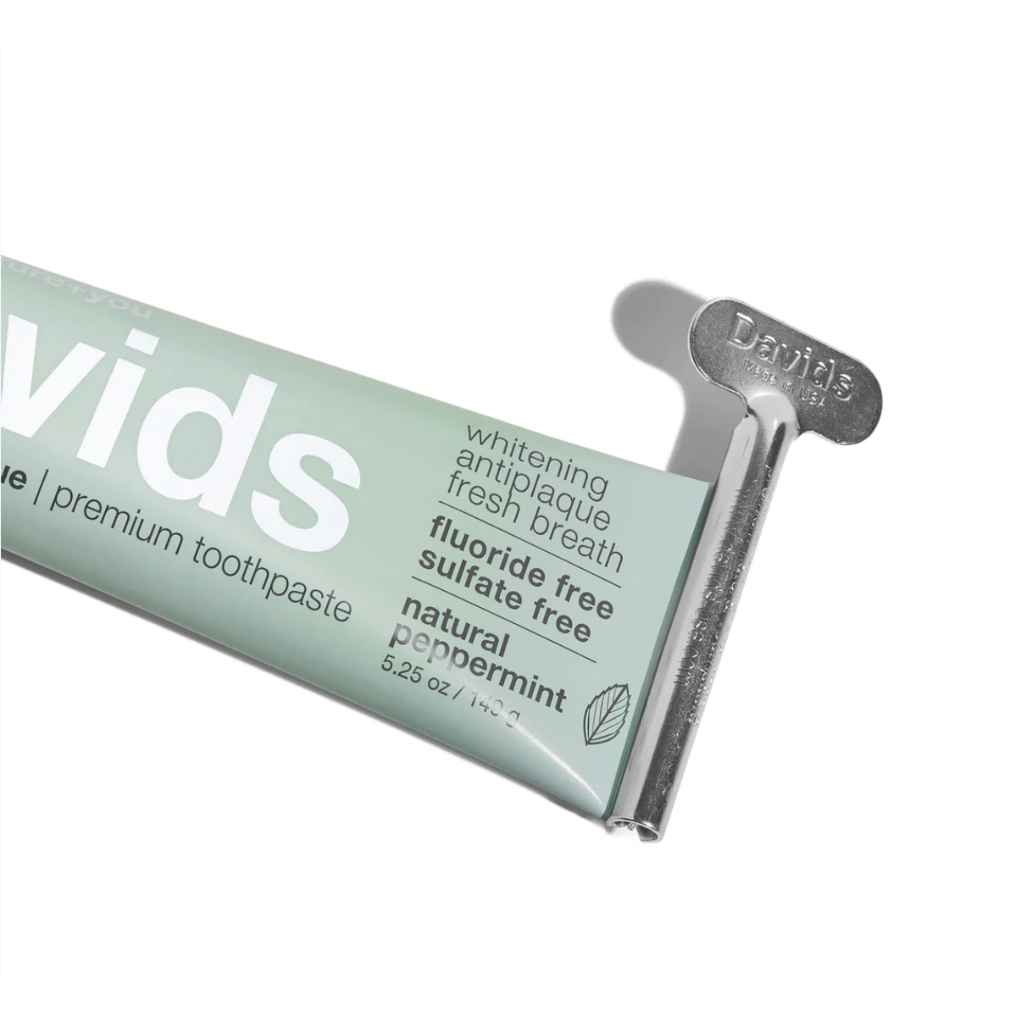 Close up photo of tube of toothpaste with metal turn key, Davids Premium Toothpaste 5.25oz in Natural Peppermint