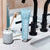 Davids Premium Toothpaste 5.25oz in Natural Spearmint shown on bathroom sink next to a bamboo toothbrush