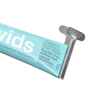 Close up photo of tube of toothpaste with metal turn key, Davids Premium Toothpaste 5.25oz in Natural Spearmint
