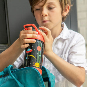 a child using an ecovessel kids insulated water bottle, space design