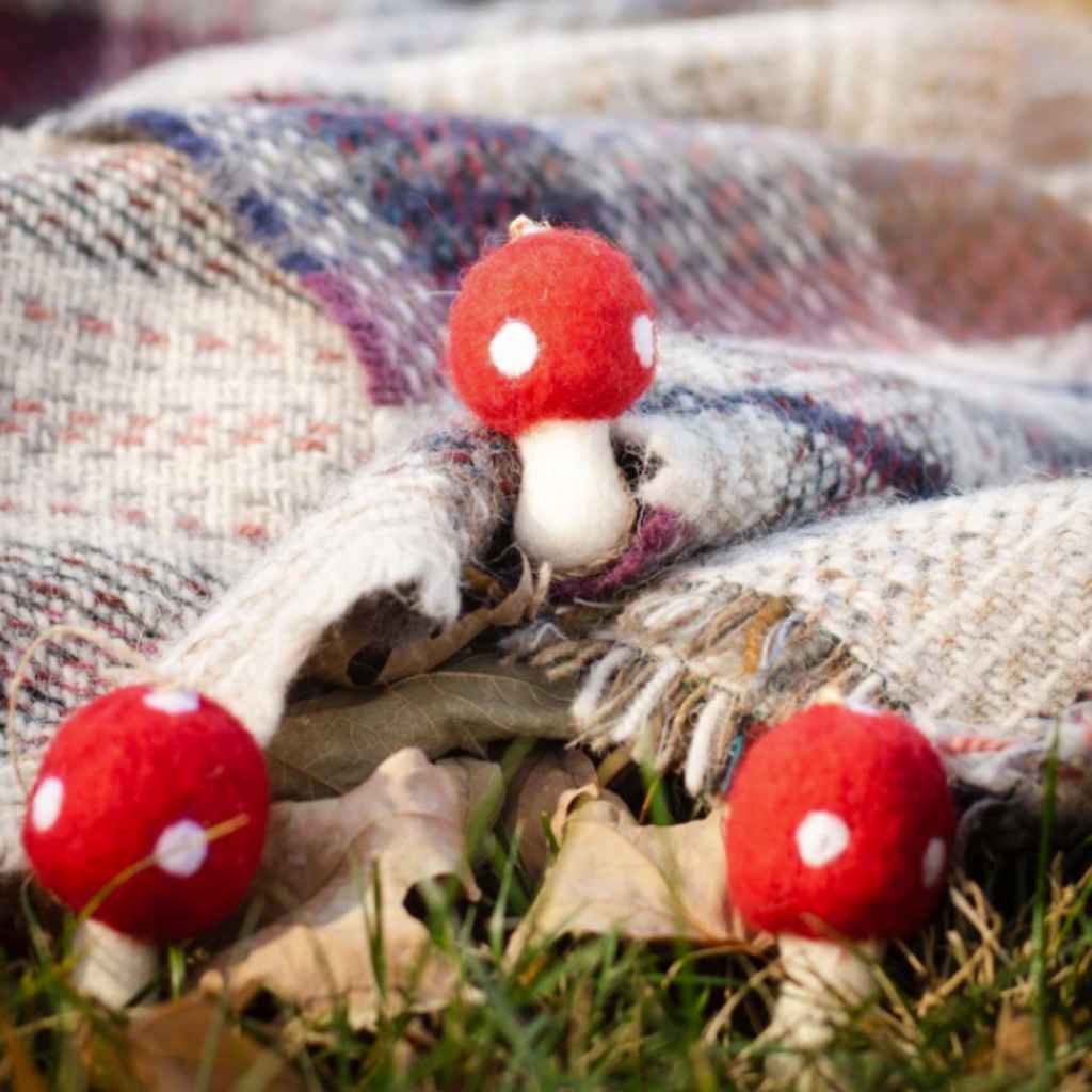 Red and white wool mushrooms for use as natural toys or essential oils (as fresheners for laundry or rooms). Set of three in a handmade bag. By Friendsheep
