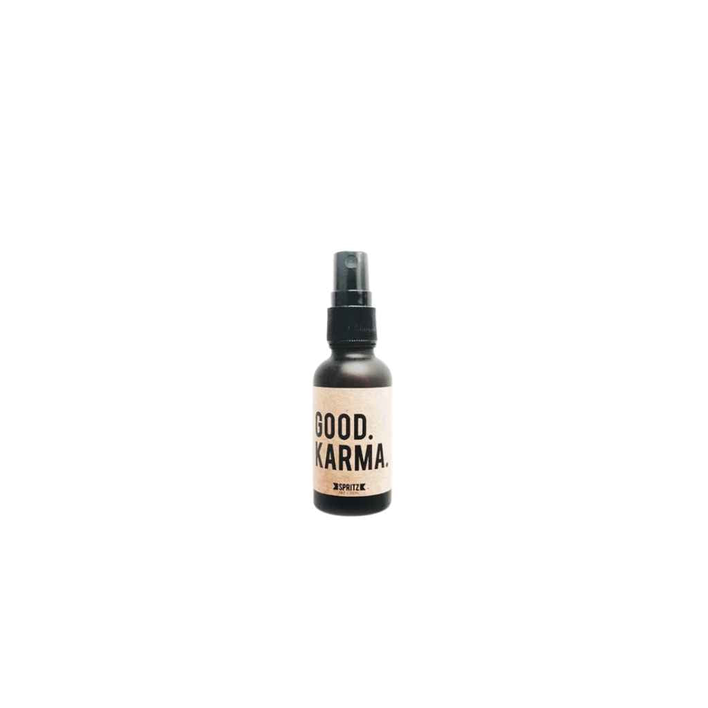 small amber glass spray bottle of Good Karma essential oil blend spray made by Happy Spritz