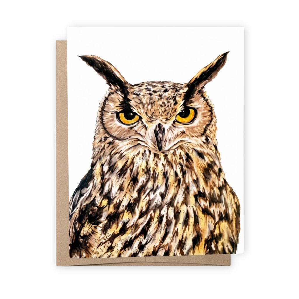A greeting card featuring a detailed illustration of a great horned owl with bright yellow eyes, shown with a brown kraft envelope on a white background.