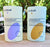 two bars of natural, plastic-free HiBar deodorant sitting on a table outside