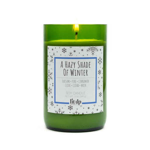100% All-natural soy candle with hemp wick in tin with lid, Hazy Shade of Winter scent by Lit Up Candle Co, happy, holiday scent with warm balsam pine combined with spicy hints of cinnamon and clove and an undertone of musky sandalwood and cedarwood. Soy wax, non-toxic, hand crafted candles made in USA. 12oz upcycled wine bottle container.