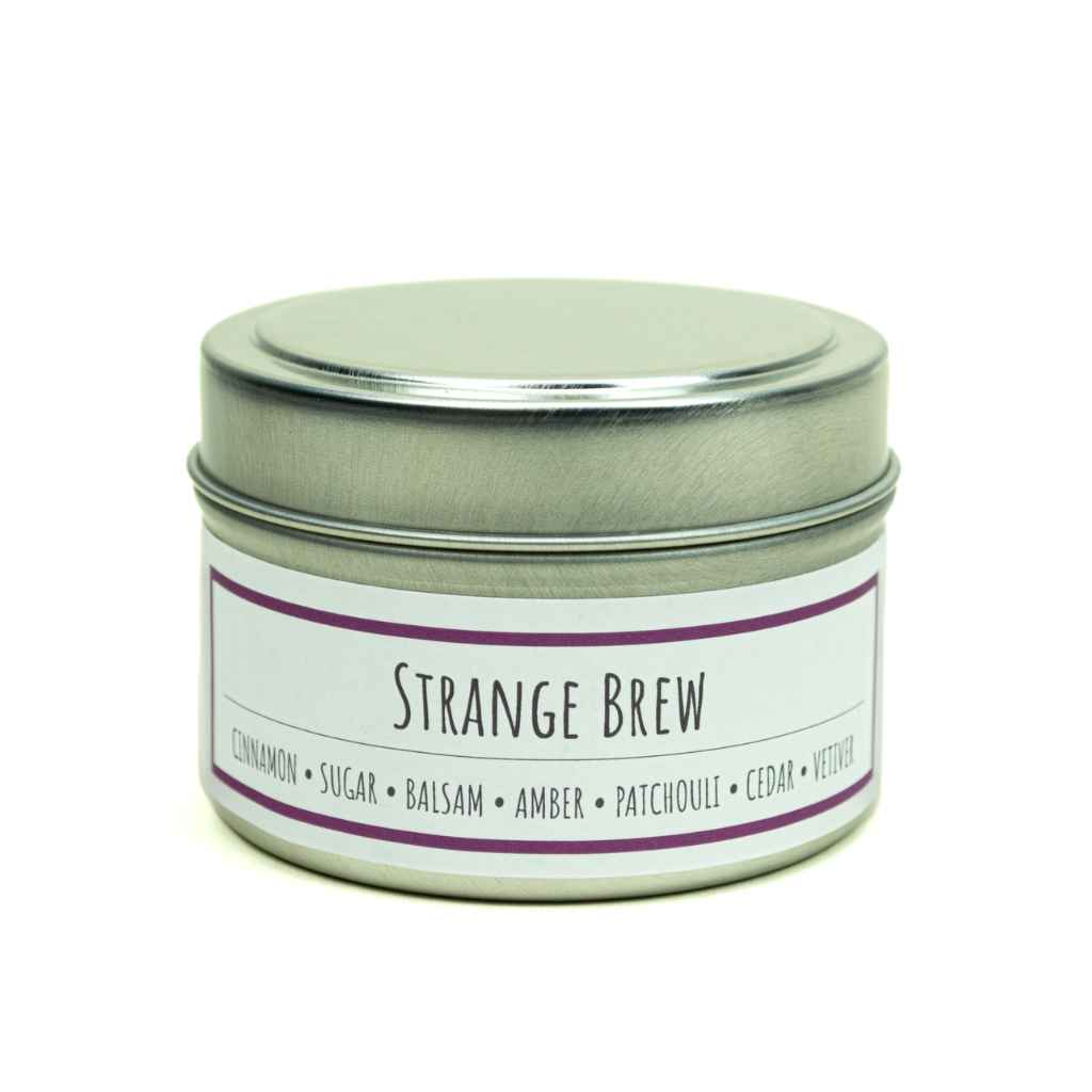 100% All-natural soy candle with hemp wick in tin with lid, Strange Brew scent by Lit Up Candle Co, Rich earthy notes of patchouli, cedar-wood and vetiver with dark amber and exotic balsam sprinkled with cinnamon and sugar. Soy wax, non-toxic, hand crafted candles made in USA. 3oz recyclable tin container with lid.