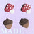 acorn and mushroom stud earrings on purple paper label .