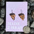 blueberry pie earrings on purple paper label on bed of rocks