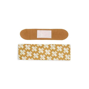 A beige bamboo bandage made by PATCH from natural fiber. Compostable, hypoallergenic, breathable, natural bandages.