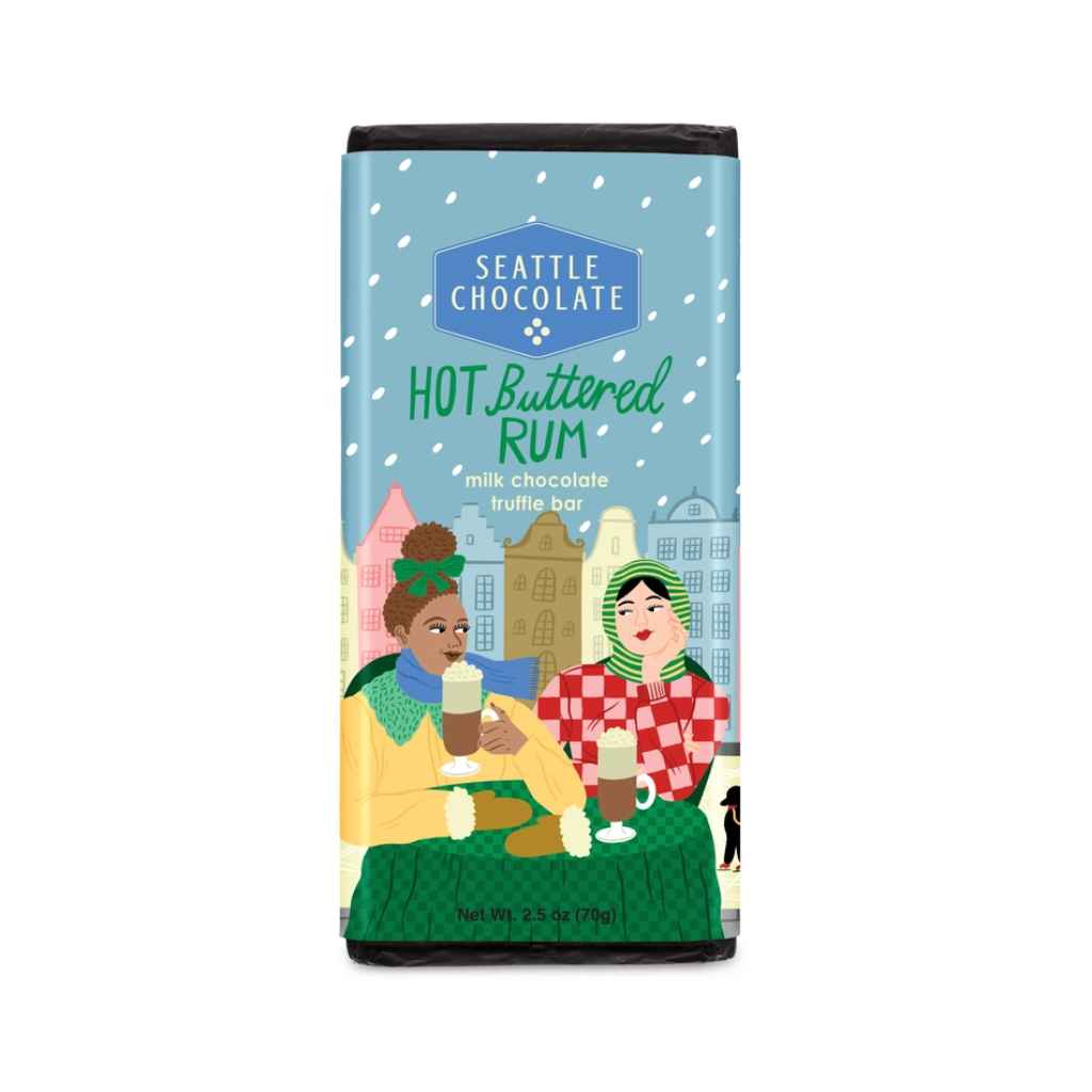 Seattle Chocolate Company, Hot Buttered Rum Milk Chocolate Truffle Bar with a hint of classic hot buttered rum spices and crunchy bits of toffee. Contains no alcohol. 2.5oz. Rainforest Alliance Certified Cacao. Non GMO.