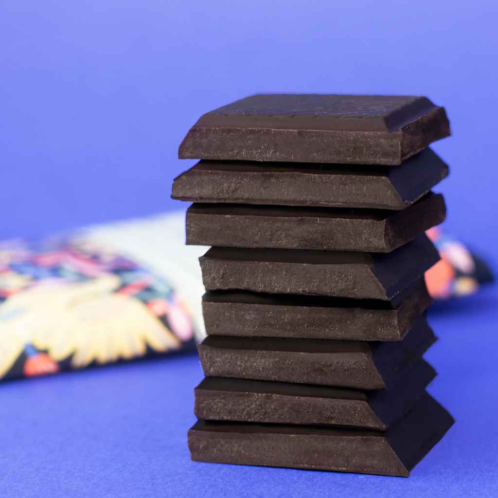 stacked pieces of Seattle Chocolate mexican hot chocolate truffle bar with cinnamon, vanilla, and cayenne pepper, 2.5 oz. Kosher. Vegan. Woman-owned business. Made in USA