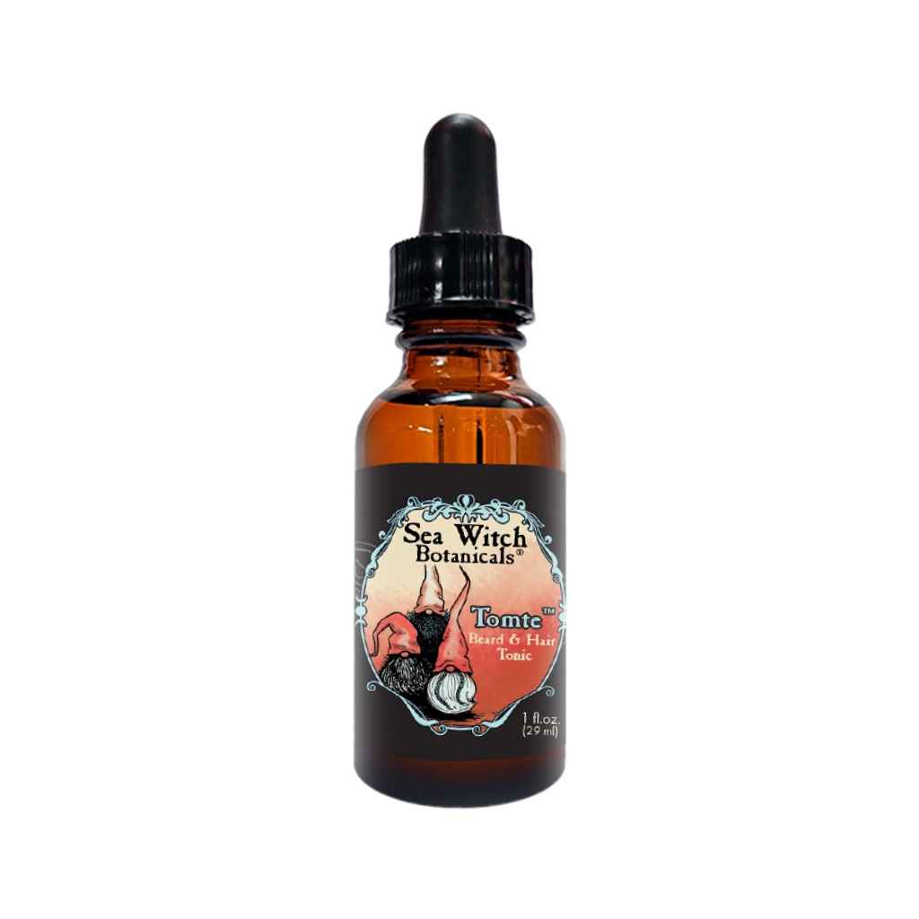 Tomte™ Beard & Hair Tonic in a small amber glass dropper bottle with a red and black label