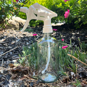 glass bottle shown with a white plastic spray top