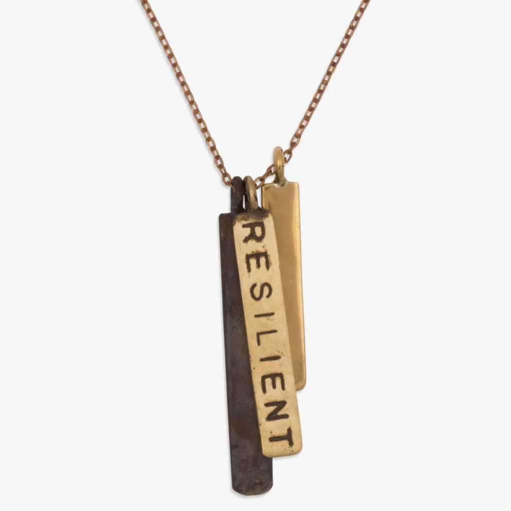 Brass necklace made of recycled brass from bombshell casings, handmade in Cambodia by fair trade artisans, upcycled meaningful jewelry, Brass Bombshell necklace. Be Resilient message.
