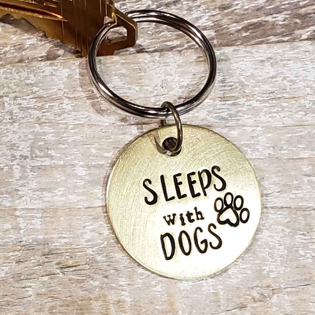 Upcycled Brass Keyring Pendant hand-stamped with the message &quot;Sleeps with Dogs&quot; made by The Junk Girls