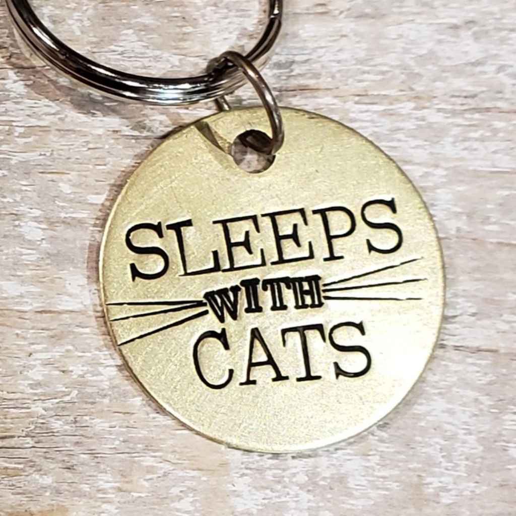 Upcycled and stamped brass pendant made by the Junk Girls with the message "Sleeps with Cats" - necklace or pendant 