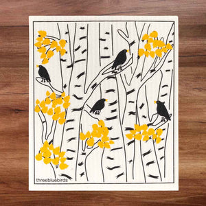 Swedish Dishcloth with yellow and black pattern, leaves on birch trees with blackbirds
