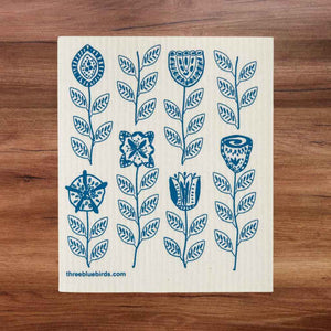 White swedish dishcloth with teal flower pattern