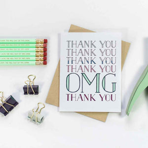 Notecard | Thank You OMG Thank You - card among other desk supplies, pencils, clips on a table