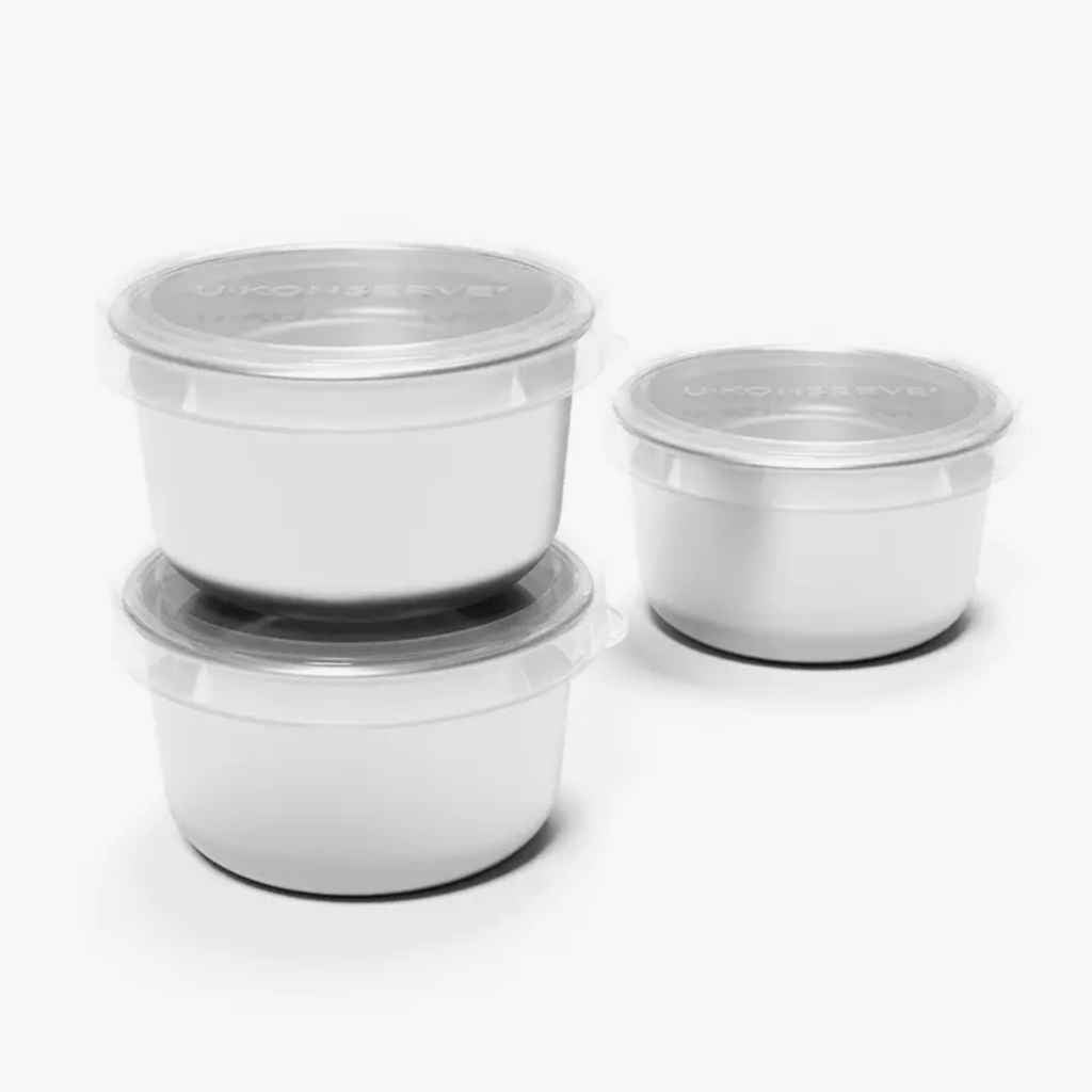 three small stainless steel food containers with clear silicone lids