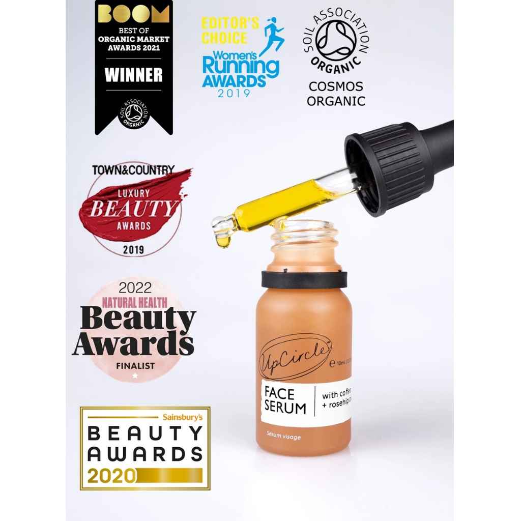 UpCircle Face Serum 10ml glass dropper bottle shown with multiple award logos