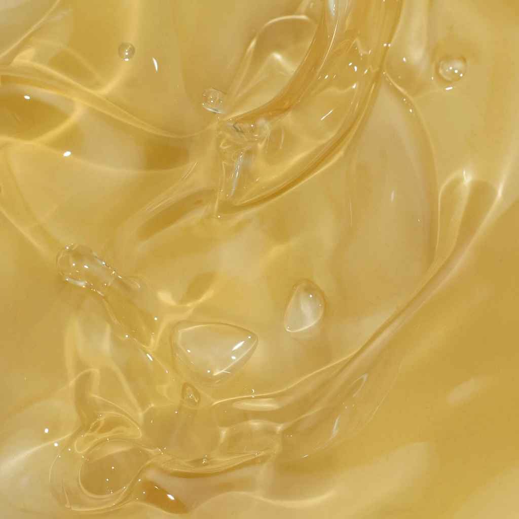 a closeup of gold-colored facial oil
