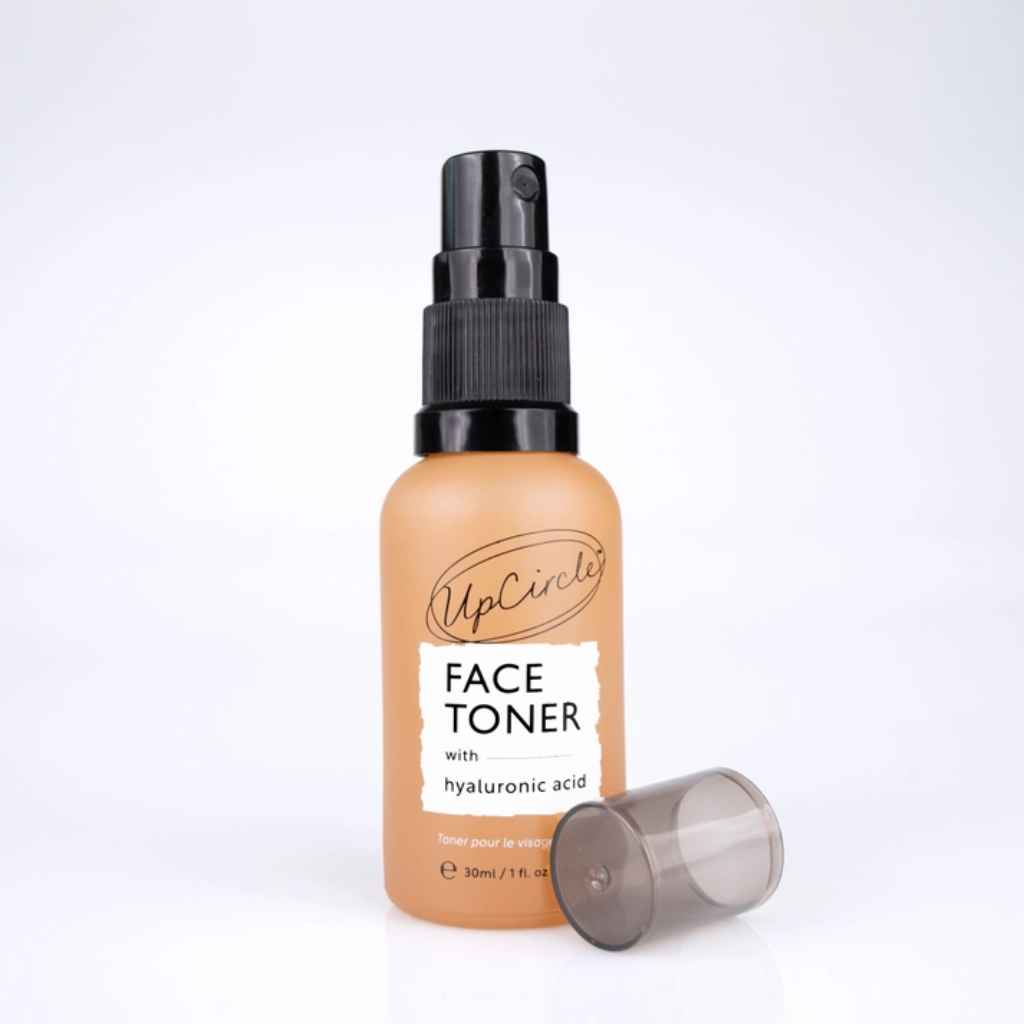 UpCircle Face Toner in travel size glass spray bottle, shown with top off